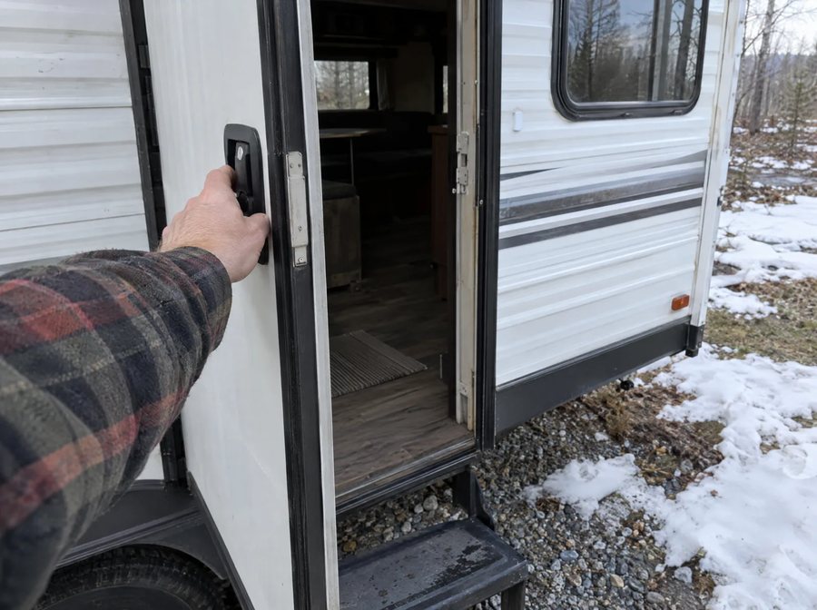 Opening the RV door in early spring